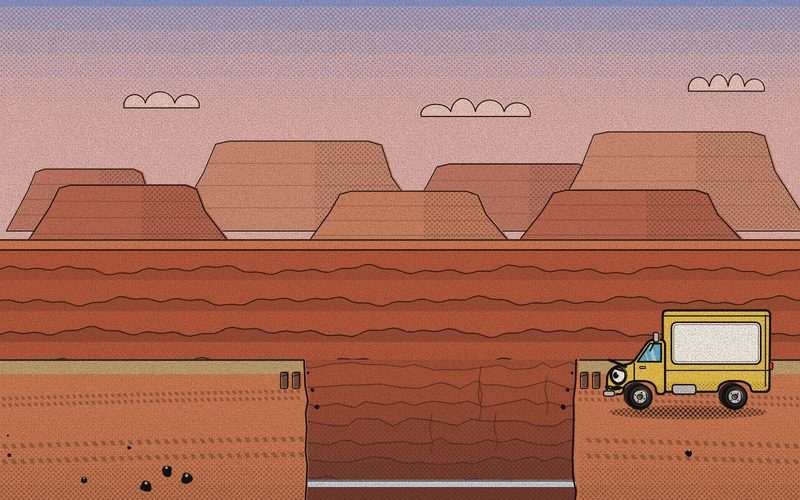 At sunrise, the yellow delivery truck sits all alone at the edge of the red canyon where the old bridge fell